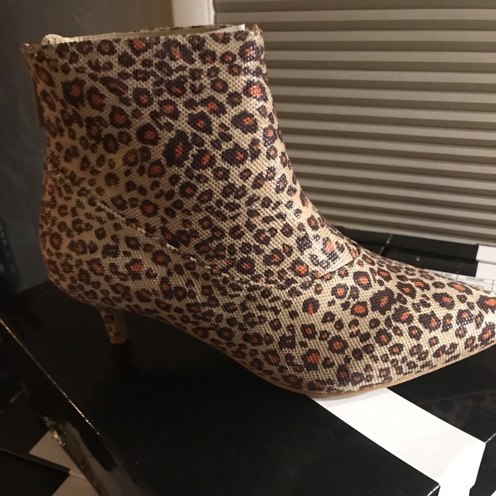Brand new thin heel leopard heel boots.
